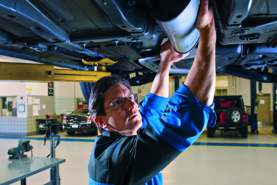Mechanic changing oil at Criswell Chrysler Jeep Dodge Ram FIAT dealership